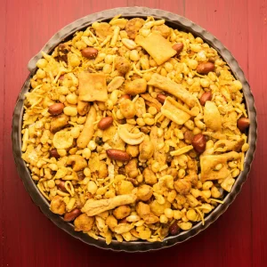 traditional-indian-deep-fried-salty-dish-chivda-mixture-farsan-farsaan-made-gram-flour-mixed-with-dry-fruits-served-bowl-plate_466689-48056